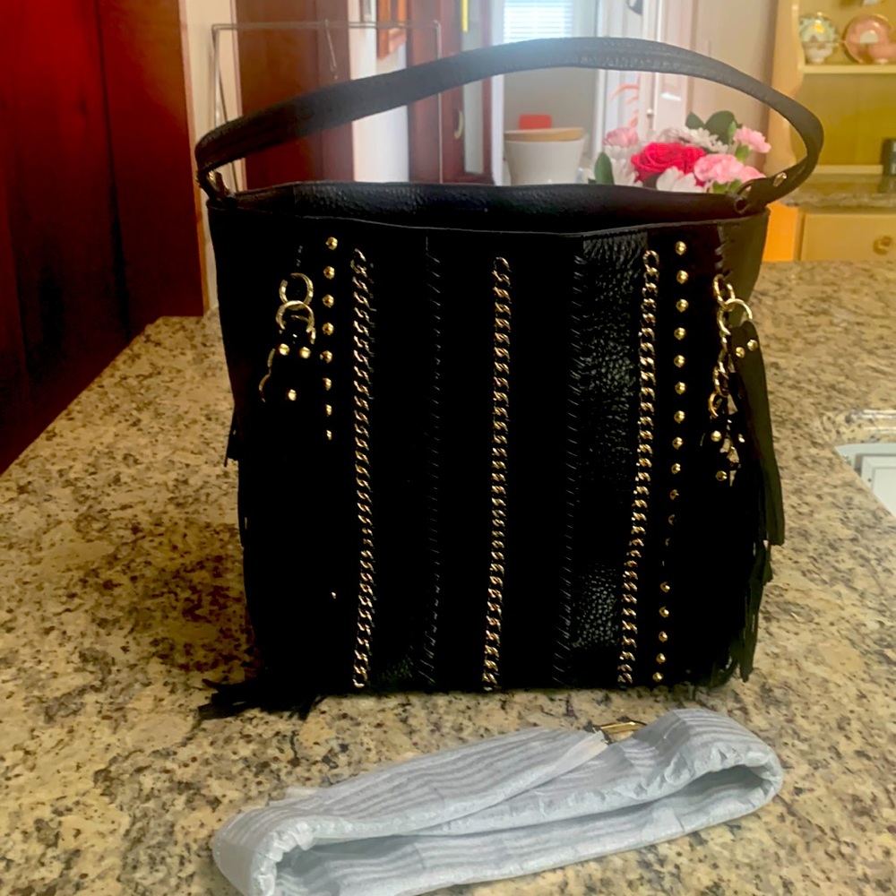 Calvin Klein Large Leather fringe tote bag.